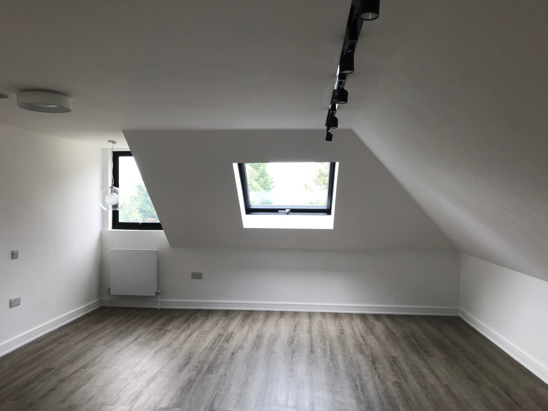 Loft bedroom conversion, North London, by Hozea Construction